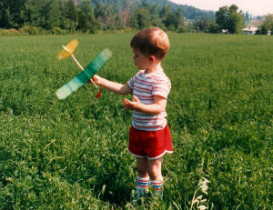 Philip Blattenberger with Comet Cadet rubber-powered airplane, Hinesburg, Vermont, circa 1988 - Airplanes and Rockets