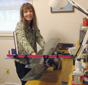 Supermodel Melanie holding the plane steady for Great Planes laser incidence meter installed on Sopwith Camel top wing - Airplanes and Rockets