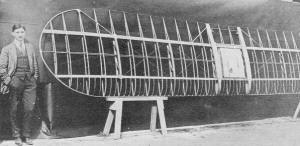 Loughead Sport Biplane History, Loughead Shop Superintendent Tony Stadlman beside the newly-completed upper wing structure of the S-1 - Airplanes and Rockets