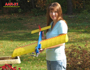 Supermodel Melanie holding my AAR-X1 electric control line stunt airplane - Airplanes and Rockets