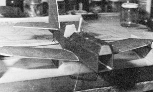 With all parts covered, bottom wings may be glued to the fuselage and blocked for proper dihedral - Airplanes and Rockets