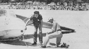 Junior Champion was Ross Briegleb, 14 (left), of El Mirage, Calif., shown after landing 2 ft. from marker - Airplanes and Rockets
