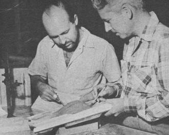 Bob Hoeppner, chief model maker, and assistant check Lincoln Futura - Airplanes and Rockets