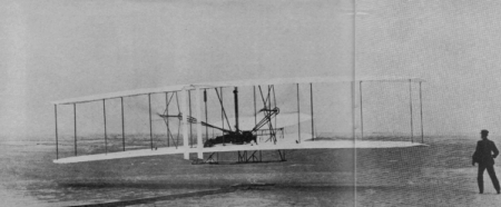 Wilbur Wright at the controls of the 1903 Wright Flyer - Airplanes and Rockets
