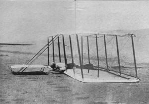 Wilbur in a prone position following a landing at Kitty Hawk of the 1901 glider - Airplanes and Rockets