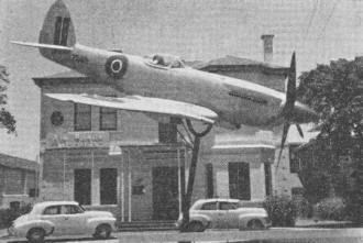 Spitfire XXII mounted in flying attitude outside Air Force Memorial House in Perth, W. Australia - Airplanes and Rockets