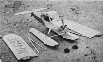 Rubber bands looped over wheel hubs give quick float attachment - Airplanes and Rockets