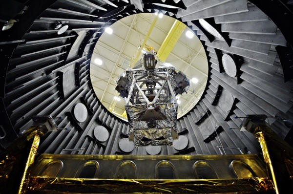 OSIM being lowered into a vacuum chamber OSIM being lowered into a vacuum chamber