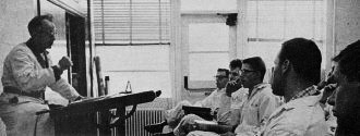 Students listen attentively to instructor at one of the 79 Federal Aviation Agency certificated schools - Airplanes and Rockets
