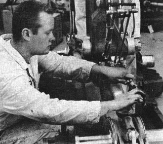 Mechanic working on hydraulic system of a landing gear - Airplanes and Rockets