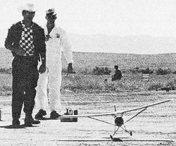 Walt Mooney on FF (Scale) - Grand Junction modeler "Kirk" Kirkam watches his Stinson 0-49 lift off for a winning flight in Gas Scale. - January 1974 AAM