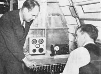 Pilot confers with engine inspector after completing tests on plane - Airplanes and Rockets