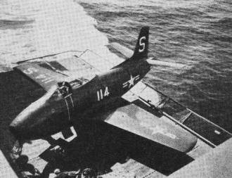Plane shown above is lowered to hangar below deck - Airplanes and Rockets