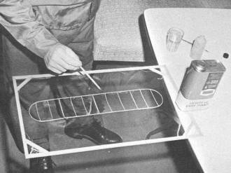 Covering process begins with wing on the film - Airplanes and Rockets